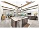 Open concept kitchen with center island, flowing into the dining and living areas for easy entertaining at 14610 Red Castle Ave, Lithia, FL 33547