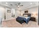 Cozy main bedroom with tray ceiling, soft carpet, and ensuite bathroom access at 14610 Red Castle Ave, Lithia, FL 33547
