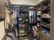 Well-organized walk-in closet with multiple racks and shelves for clothes, shoes, and accessories at 14610 Red Castle Ave, Lithia, FL 33547