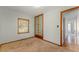 Bedroom features neutral walls, carpeted floors, and natural light from window at 1501 W Trapnell Rd, Plant City, FL 33566