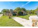 Charming home with a stone chimney and well-maintained lawn in a quiet, green neighborhood at 1501 W Trapnell Rd, Plant City, FL 33566
