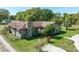 Beautiful single-story home with stone chimney, wood siding, and well-manicured lawn at 1501 W Trapnell Rd, Plant City, FL 33566
