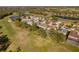 Aerial view of the neighborhood featuring homes, lakes, and lush landscaping at 15618 Shoal Creek Pl, Odessa, FL 33556