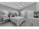 Bright bedroom with hardwood floors, closet space, and a comfortable neutral color palette at 15618 Shoal Creek Pl, Odessa, FL 33556