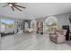 Spacious bonus room filled with natural light, featuring built-in bookshelves and a comfortable seating area at 15618 Shoal Creek Pl, Odessa, FL 33556