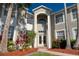 Beautiful front entry highlighting the home's architectural details, landscaping and a brick walkway at 15618 Shoal Creek Pl, Odessa, FL 33556
