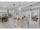 Spacious kitchen with granite counters, island with pendant lights, and seamless access to dining areas at 15618 Shoal Creek Pl, Odessa, FL 33556