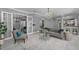 Spacious living room with French doors, a chandelier, and gray decor creating an elegant and inviting atmosphere at 15618 Shoal Creek Pl, Odessa, FL 33556