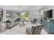 Living room showcasing pool views, comfortable seating, and decorative accents, perfect for relaxation at 15618 Shoal Creek Pl, Odessa, FL 33556
