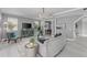 Bright living room featuring comfortable seating, stylish decor, and ample natural light at 15618 Shoal Creek Pl, Odessa, FL 33556