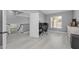 Upstairs office with a computer desk, a window for natural light, and wood-look floors at 15618 Shoal Creek Pl, Odessa, FL 33556
