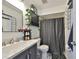 Nicely decorated bathroom with vanity, mirror and shower with curtain at 1824 Mill Run Cir, Tampa, FL 33613