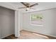 Bedroom featuring light walls, wood-look floors, closet, and a window offering natural light at 18406 Sterling Silver Cir, Lutz, FL 33549