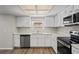 Bright kitchen features stainless steel appliances, new flooring, and lots of counter space at 18406 Sterling Silver Cir, Lutz, FL 33549