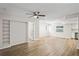 Open-concept living space with built-in shelves and modern flooring at 18406 Sterling Silver Cir, Lutz, FL 33549