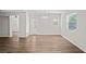 Open floor plan living room with natural light and access to backyard at 18406 Sterling Silver Cir, Lutz, FL 33549