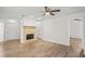 Spacious living room featuring a decorative fireplace and new floors at 18406 Sterling Silver Cir, Lutz, FL 33549