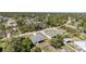 Scenic aerial view of a home and surrounding neighborhood with a canopy of trees at 2202 Yalta Ter, North Port, FL 34286