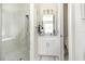 Bright bathroom featuring a tiled glass shower, a modern vanity, and bright natural light at 2202 Yalta Ter, North Port, FL 34286