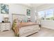 Inviting bedroom featuring a decorative bed frame, neutral colors, and plenty of natural light at 2202 Yalta Ter, North Port, FL 34286