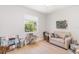 Cozy bedroom with a neutral color palette, natural light, and hardwood floors at 2202 Yalta Ter, North Port, FL 34286