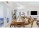 Bright dining room features a large table, modern lighting, and neutral decor at 2202 Yalta Ter, North Port, FL 34286