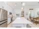 Bright kitchen featuring white cabinets, stainless steel appliances, and an expansive island at 2202 Yalta Ter, North Port, FL 34286