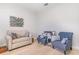Comfortable living room with hardwood floors, neutral walls, and lots of light at 2202 Yalta Ter, North Port, FL 34286
