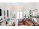 Spacious living room with stylish furniture, light wood floors, and plenty of natural light at 2202 Yalta Ter, North Port, FL 34286