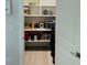 Walk-in pantry with ample shelving space for organized storage at 2202 Yalta Ter, North Port, FL 34286