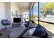 Relaxing screened porch with comfortable seating and views of the backyard at 2202 Yalta Ter, North Port, FL 34286