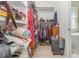 Spacious walk-in closet with custom shelving and ample storage space for clothes and accessories at 2202 Yalta Ter, North Port, FL 34286