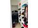 Organized walk-in closet with custom shelving and ample storage for clothes and shoes at 2202 Yalta Ter, North Port, FL 34286