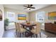 This dining room showcases a lovely table, ample seating, and plenty of natural light at 24276 Peppercorn Rd, Punta Gorda, FL 33955