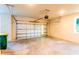 Spacious garage with a standard sectional door and ample room for storage at 24276 Peppercorn Rd, Punta Gorda, FL 33955