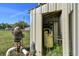 Storage outbuilding containing well equipment, and pressure tanks in an outdoor setting at 27547 Miller Rd, Dade City, FL 33525