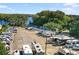 Expansive aerial view of a well-maintained RV park with lake access and mature trees at 2958 Macalpin N Dr, Palm Harbor, FL 34684