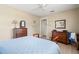 Cozy bedroom offers natural light, wood floors, and neutral wall colors at 2958 Macalpin N Dr, Palm Harbor, FL 34684