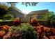 A beautifully landscaped entrance to the Highland Lakes Golf Club clubhouse at 2958 Macalpin N Dr, Palm Harbor, FL 34684