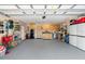 Spacious garage with ample storage cabinets, perfect for organization and convenience at 2958 Macalpin N Dr, Palm Harbor, FL 34684