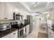 Bright kitchen with stainless steel appliances, granite countertops and lots of storage at 2958 Macalpin N Dr, Palm Harbor, FL 34684