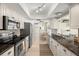 Bright kitchen with stainless steel appliances, granite countertops and lots of storage at 2958 Macalpin N Dr, Palm Harbor, FL 34684