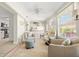 Comfortable living room with large windows, lots of seating, and natural light at 2958 Macalpin N Dr, Palm Harbor, FL 34684