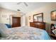 Cozy main bedroom featuring wooden furniture, calming decor, and lots of space at 2958 Macalpin N Dr, Palm Harbor, FL 34684