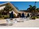 Charming outdoor seating area with tables, chairs, and umbrellas for enjoying the outdoors at 2958 Macalpin N Dr, Palm Harbor, FL 34684