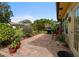 Charming outdoor patio features brick pavers, a grill, and lush landscaping, perfect for entertaining at 2958 Macalpin N Dr, Palm Harbor, FL 34684