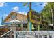 Exterior of Thirsty Marlin Grill & Bar with colorful signage, outdoor seating, and festive decorations at 2958 Macalpin N Dr, Palm Harbor, FL 34684