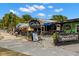 Outdoor seating area at Coolside Gelato Bar, an inviting space for enjoying fine Italian ice cream at 2958 Macalpin N Dr, Palm Harbor, FL 34684