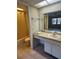 Bathroom with single sink vanity, tile floors, and tub and shower combo at 3046 Eastland Blvd # J106, Clearwater, FL 33761