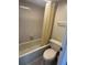 Bathroom featuring a shower and toilet at 3046 Eastland Blvd # J106, Clearwater, FL 33761